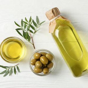 imgi_160_olives-bottle-bowl-with-olive-oil-wooden-top-view_185193-10120
