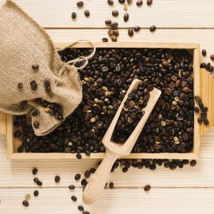 top-view-wooden-tray-with-coffee-beans